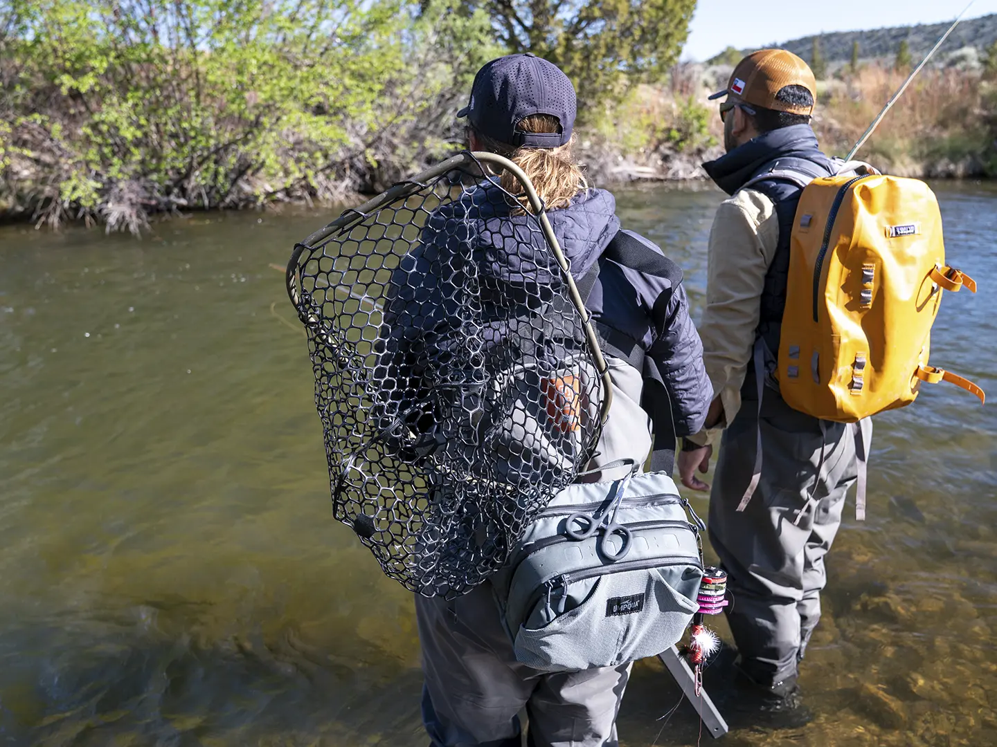 Anglers wading a clear freestone river near Dubois, Wyoming